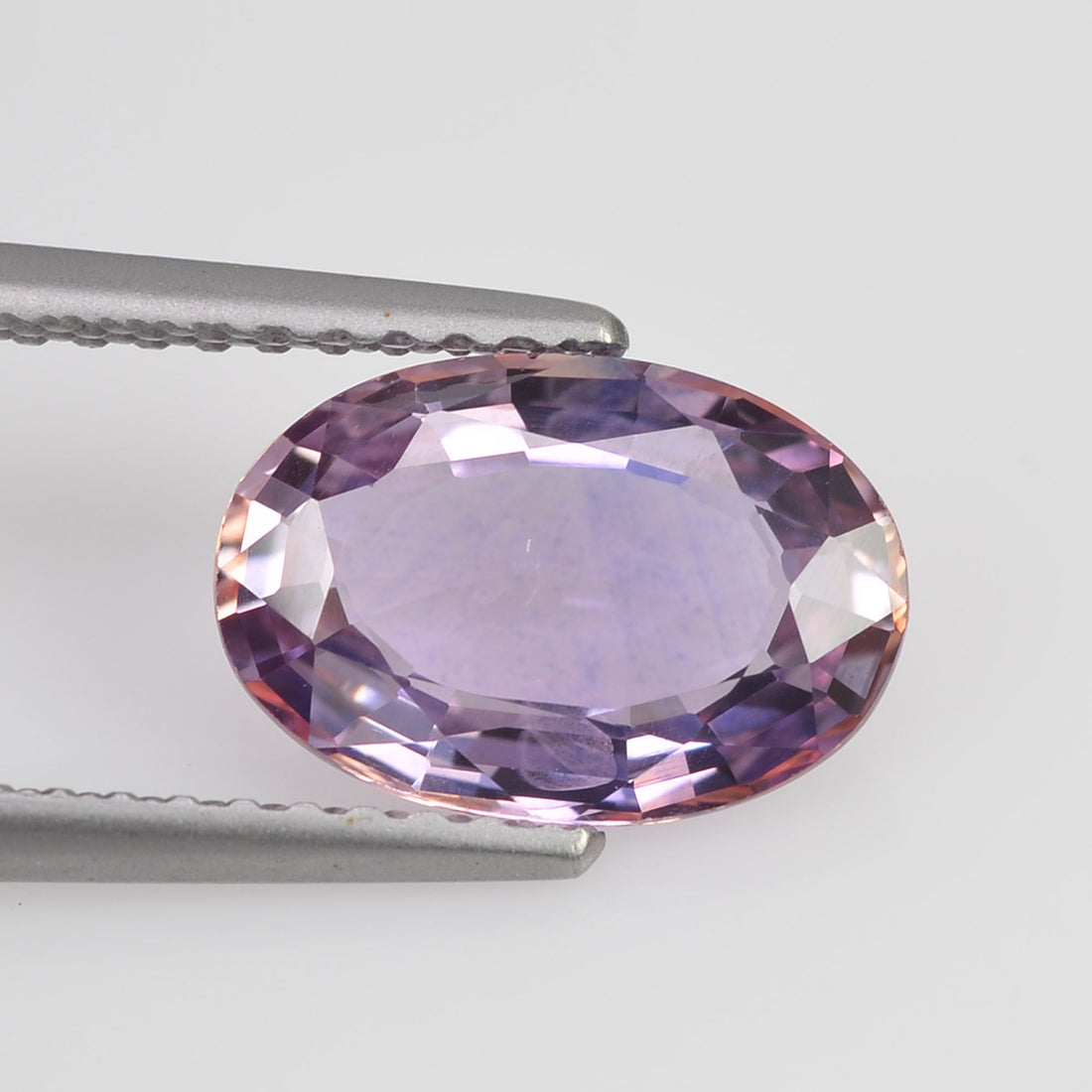2.07 cts Natural Fancy Peach Blue Sapphire Loose Gemstone oval Cut - Thai Gems Export Ltd.