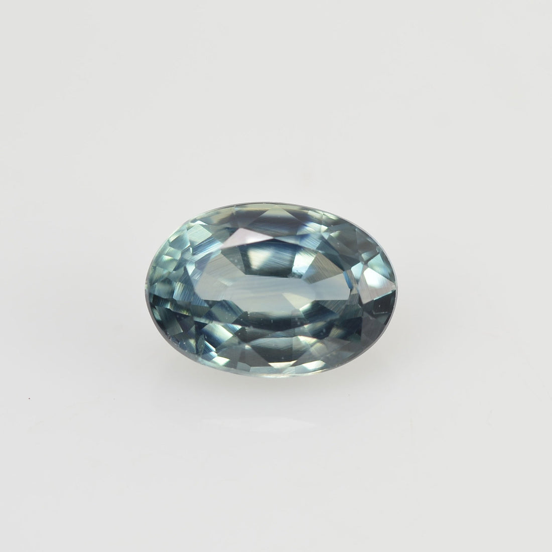 0.67 cts Natural Blue Green Teal Sapphire Loose Gemstone Oval Cut - Thai Gems Export Ltd.