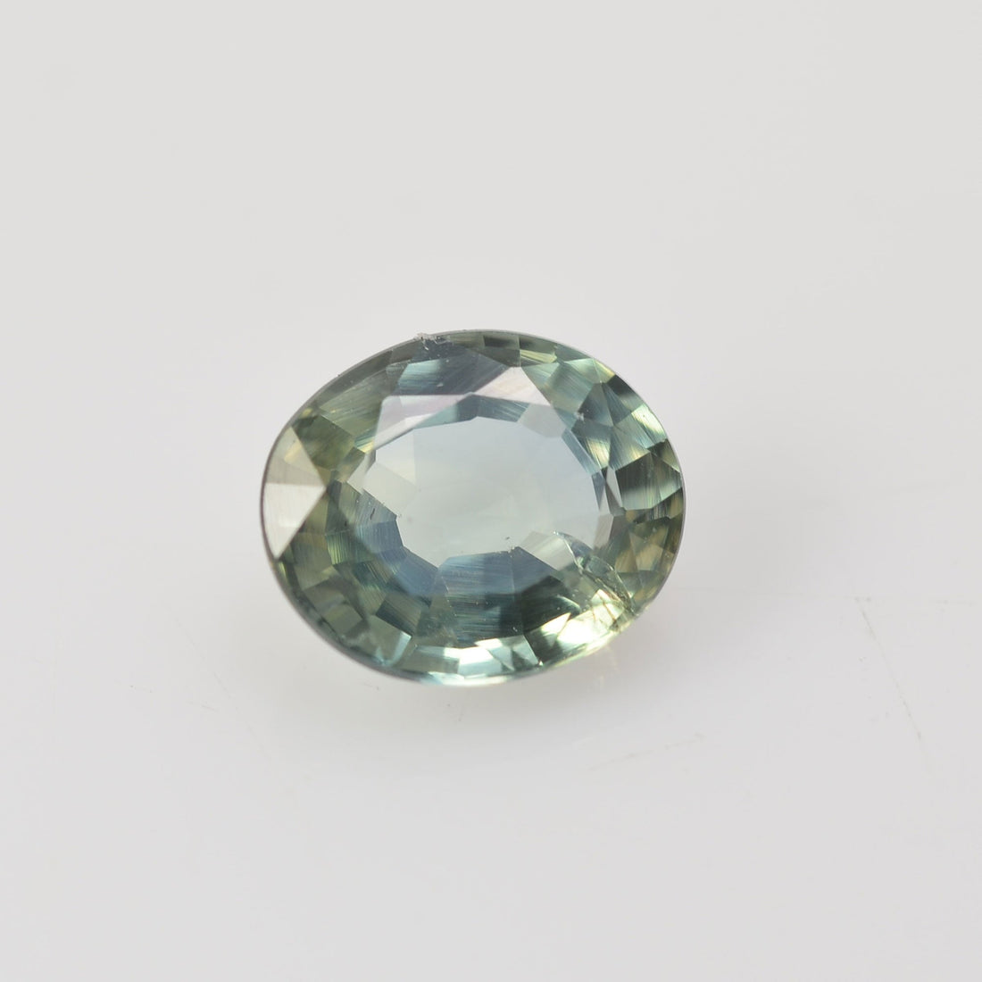 0.72 cts Natural Green Teal Sapphire Loose Gemstone Oval Cut - Thai Gems Export Ltd.