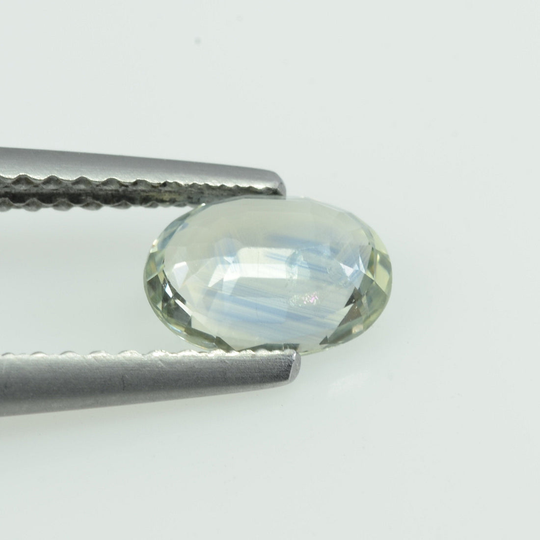 0.94 cts Natural Bi-color Sapphire Loose Gemstone Oval Cut - Thai Gems Export Ltd.