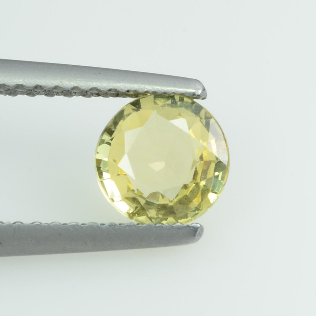 0.96 Cts Natural Yellow Sapphire Loose Gemstone Round Cut - Thai Gems Export Ltd.