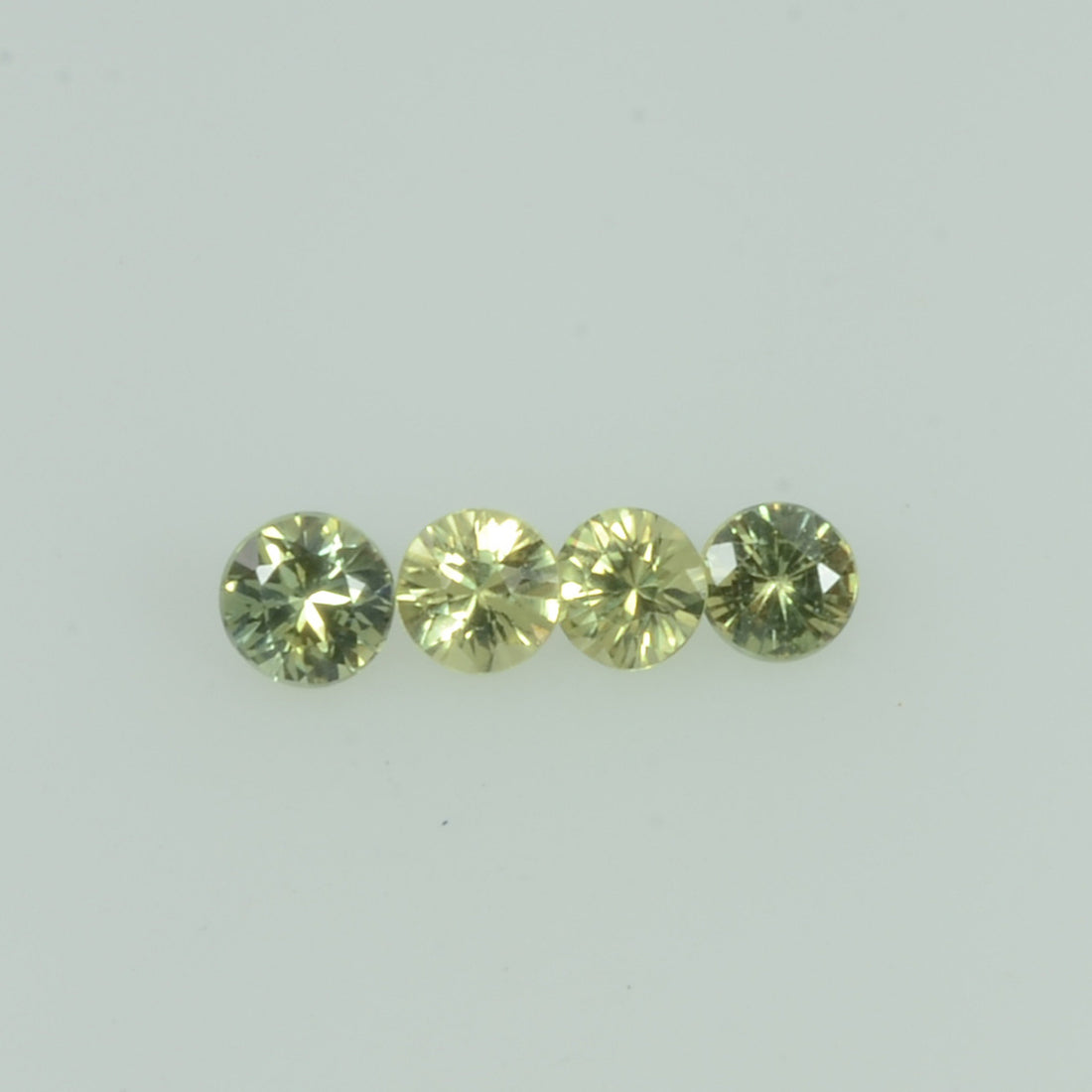 1.4- 3.5 mm Natural Yellowish Green Sapphire Loose Gemstone Round Diamond Cut Color - Thai Gems Export Ltd.