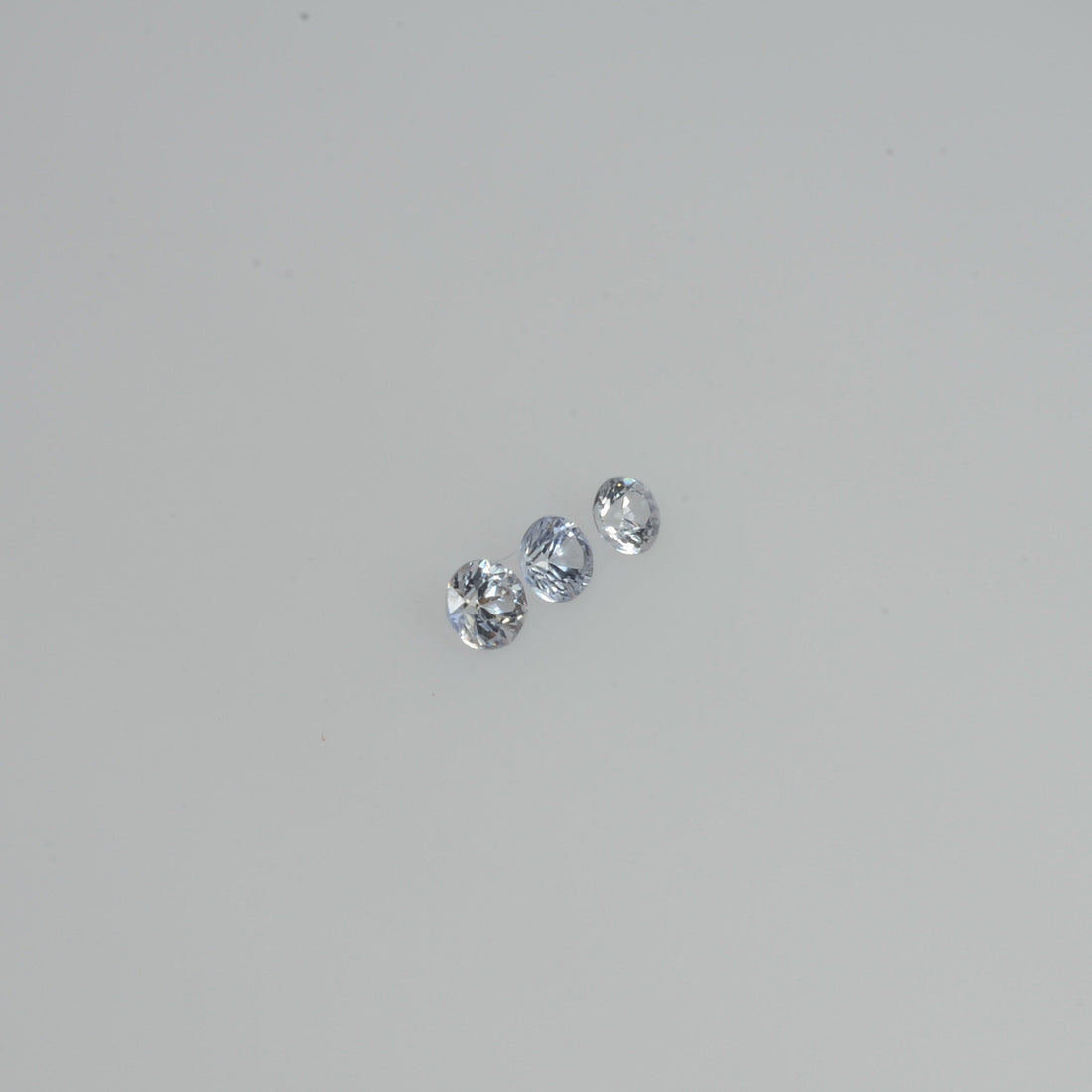 2.5-4.0   mm Natural Whitish Blue Sapphire Loose Cleanish Quality  Gemstone Round Diamond Cut - Thai Gems Export Ltd.